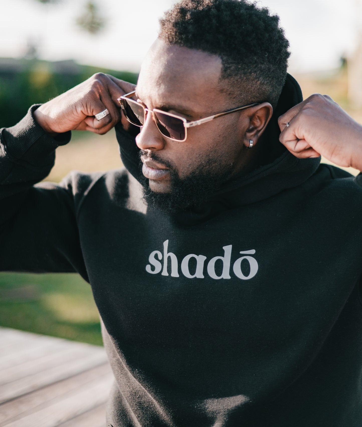 Shadō luminescent unisex black hoodie.